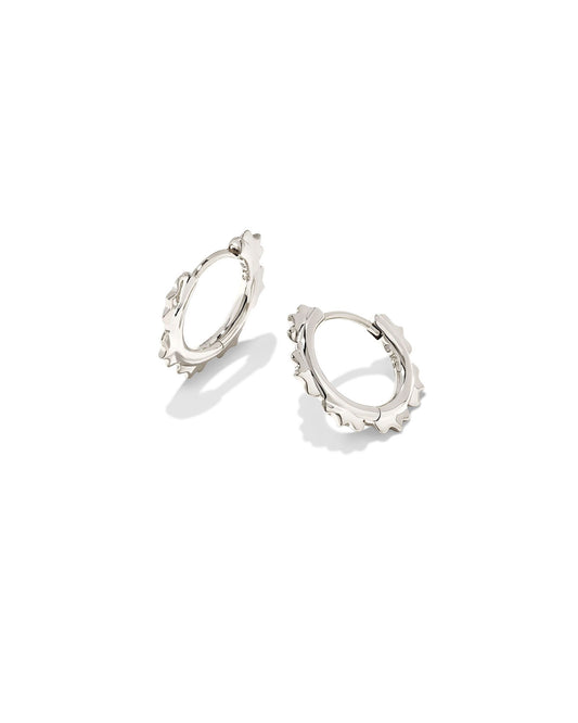 The trending huggie style meets intricate metal detailing in the Genevieve Huggie Earrings in Silver. Dainty and lightweight, floral-inspired metal shapes elevate these huggies for a truly unique style.  Dimensions- 0.58'L X 0.68'W Metal- Rhodium Over Brass Closure- Ear Post