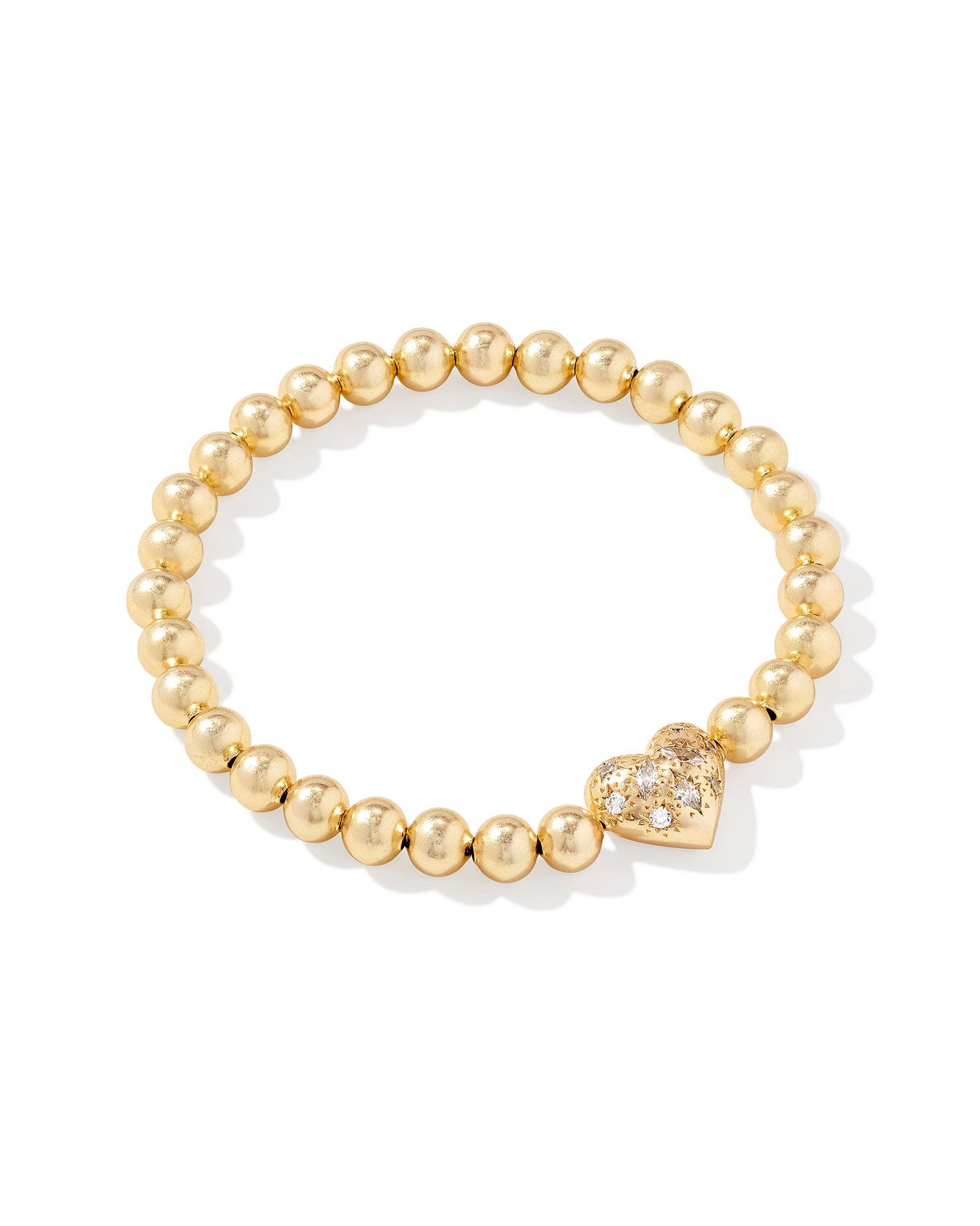 Gold beaded bracelet with Heart pendant that has clear crystals in the pendant. 
Metal- 14K Yellow Gold Plated
Closure-Stretch Bracelet
Size- 6.5' UNSTRETCHED CIRCUMFERENCE, 0.4" L X 0.35" W STATION