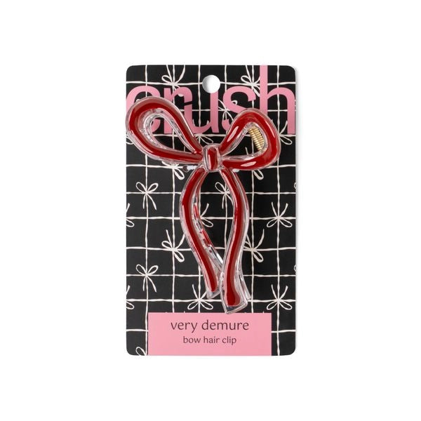 Red bow hair clip on a branded card with 'Crush' logo