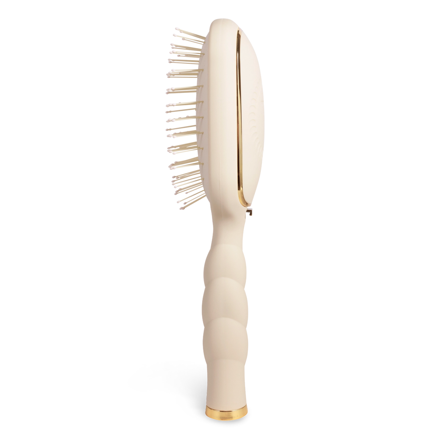 Oval hair brush, beige handle, gentle glide bristle, textured handle with gold trim shown from the side. 