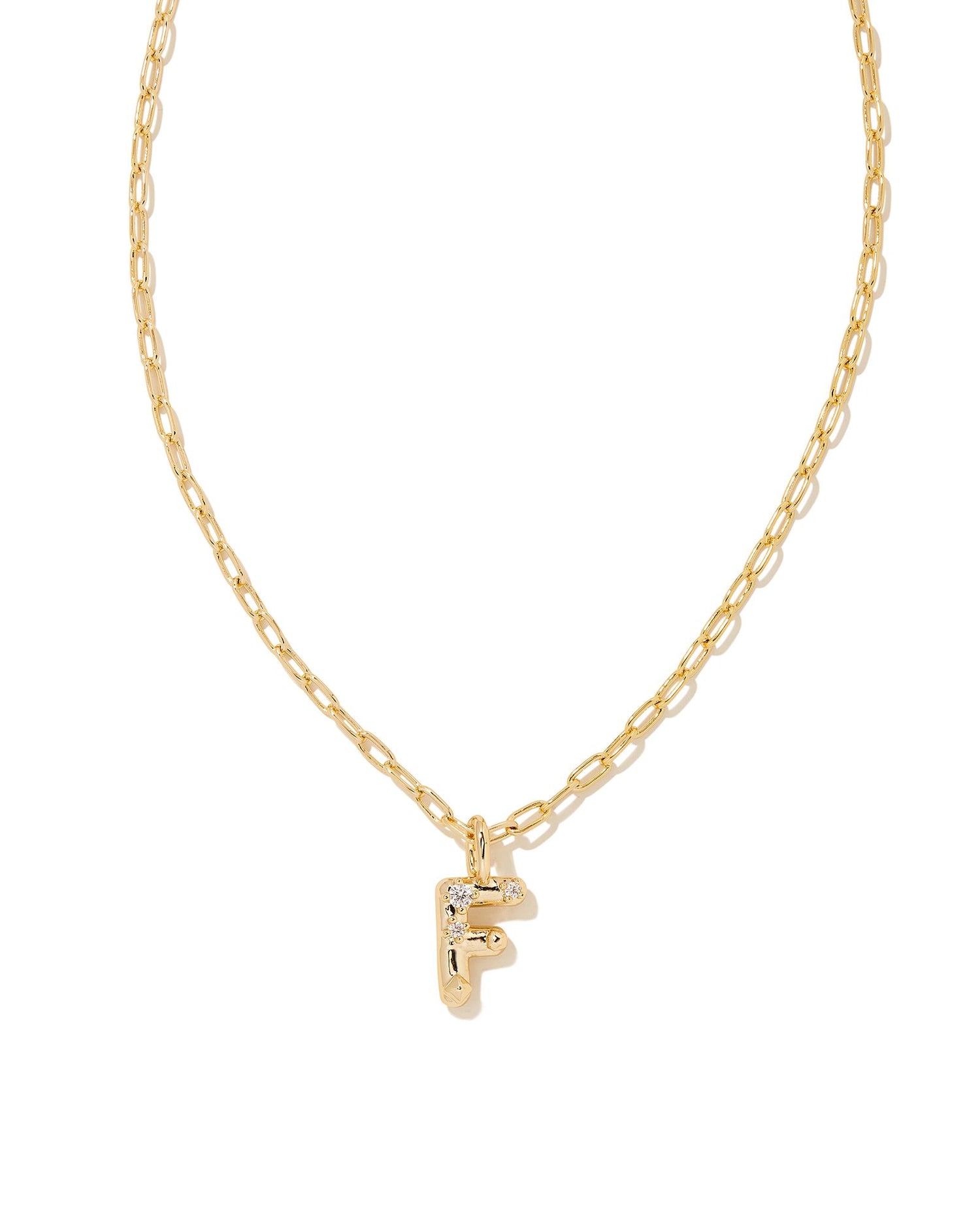 Personalize your everyday look with the Crystal Letter Short Pendant Necklace in White Crystal. Whether you’re rocking your initial or a loved one’s, this sentimental layer is one you’ll keep coming back to again and again.  Dimensions- 16' CHAIN WITH 3' EXTENDER, 0.62'L X 0.35"W PENDANT Metal- 14K Gold plated over brass Closure- Lobster Clasp Material-   White CZ Letter F