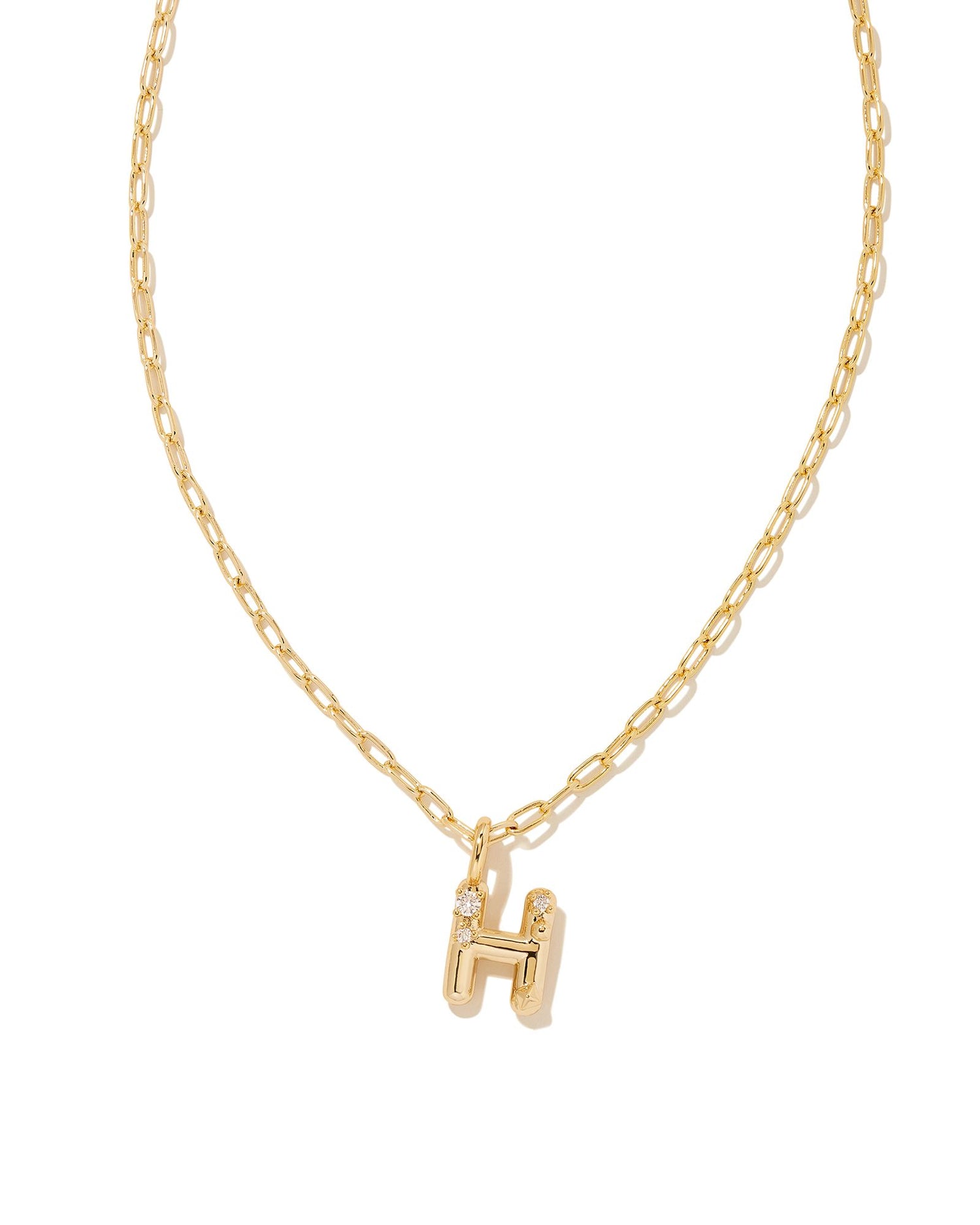 Personalize your everyday look with the Crystal Letter Short Pendant Necklace in White Crystal. Whether you’re rocking your initial or a loved one’s, this sentimental layer is one you’ll keep coming back to again and again.  Dimensions- 16' CHAIN WITH 3' EXTENDER, 0.62'L X 0.35"W PENDANT Metal- 14K Gold plated over brass Closure- Lobster Clasp Material-   White CZ Letter H