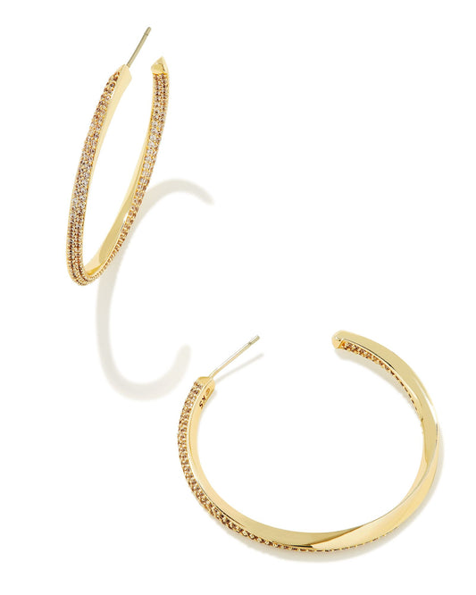 Your favorite hoops get an unexpected twist in the Ella Gold Hoop Earrings in White Crystal. Featuring a unique twisted metal design, these hoops are elevated even further with gorgeous micro pavé crystals. Every stack needs a bit of sparkle, and these hoops bring just that—and so much more.
