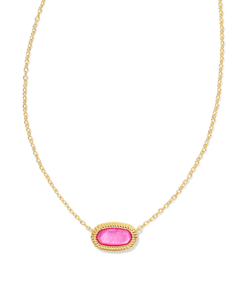 gold necklace with a framed pendant around a pink stone