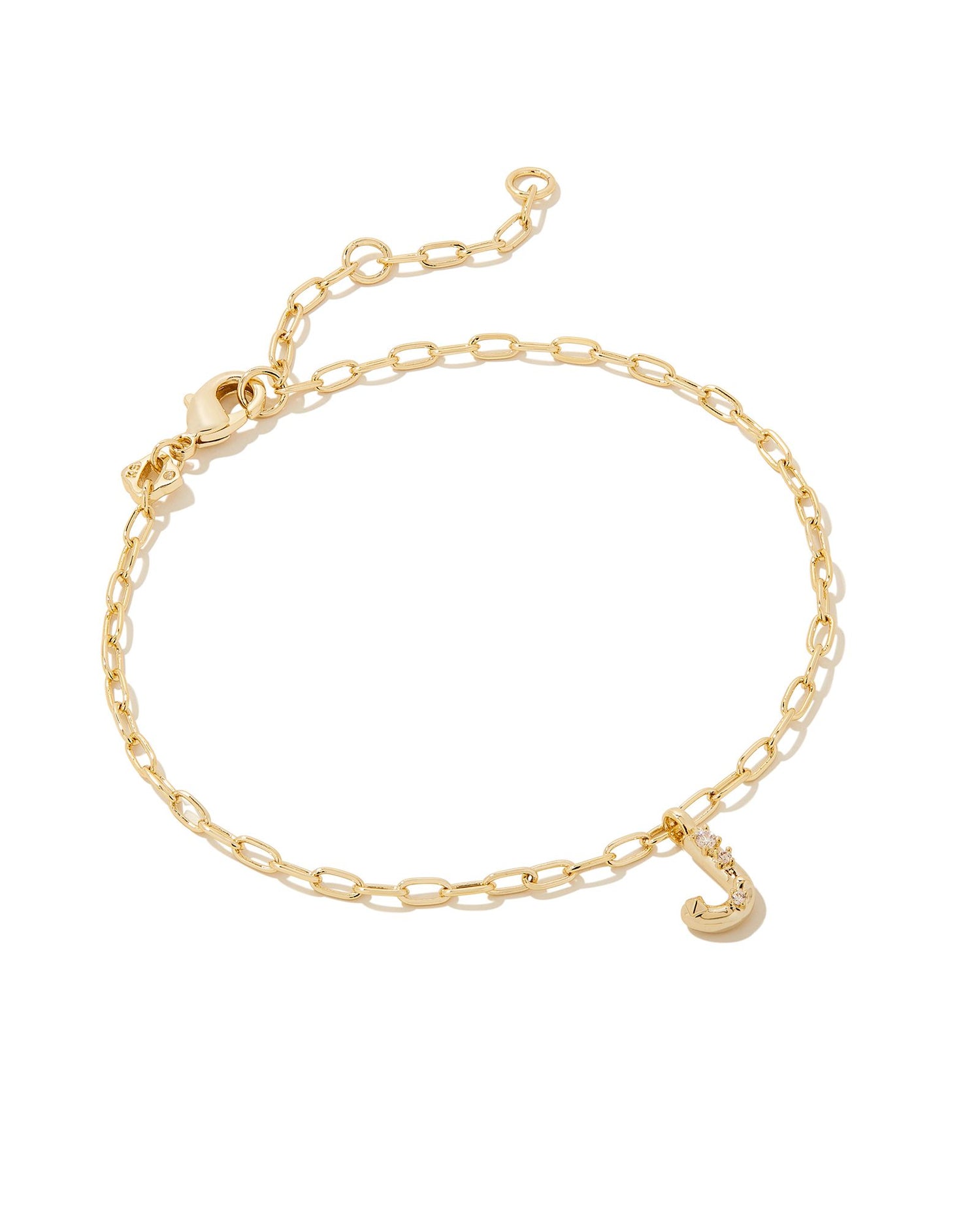 Add a personal touch to your wrist stack with the Crystal Delicate Chain Bracelet in White Crystal, our first Fashion Jewelry initial bracelet. Featuring a dainty chain and letter charm with a hint of sparkle, this bracelet is the perfect way to celebrate the ones you love—including yourself!  Dimensions- 6.5' CHAIN WITH 1.5' EXTENDER, 0.45'L X 0.26"W PENDANT Metal- 14K Gold plated over brass Closure- Lobster Clasp Material-  White CZ Letter J