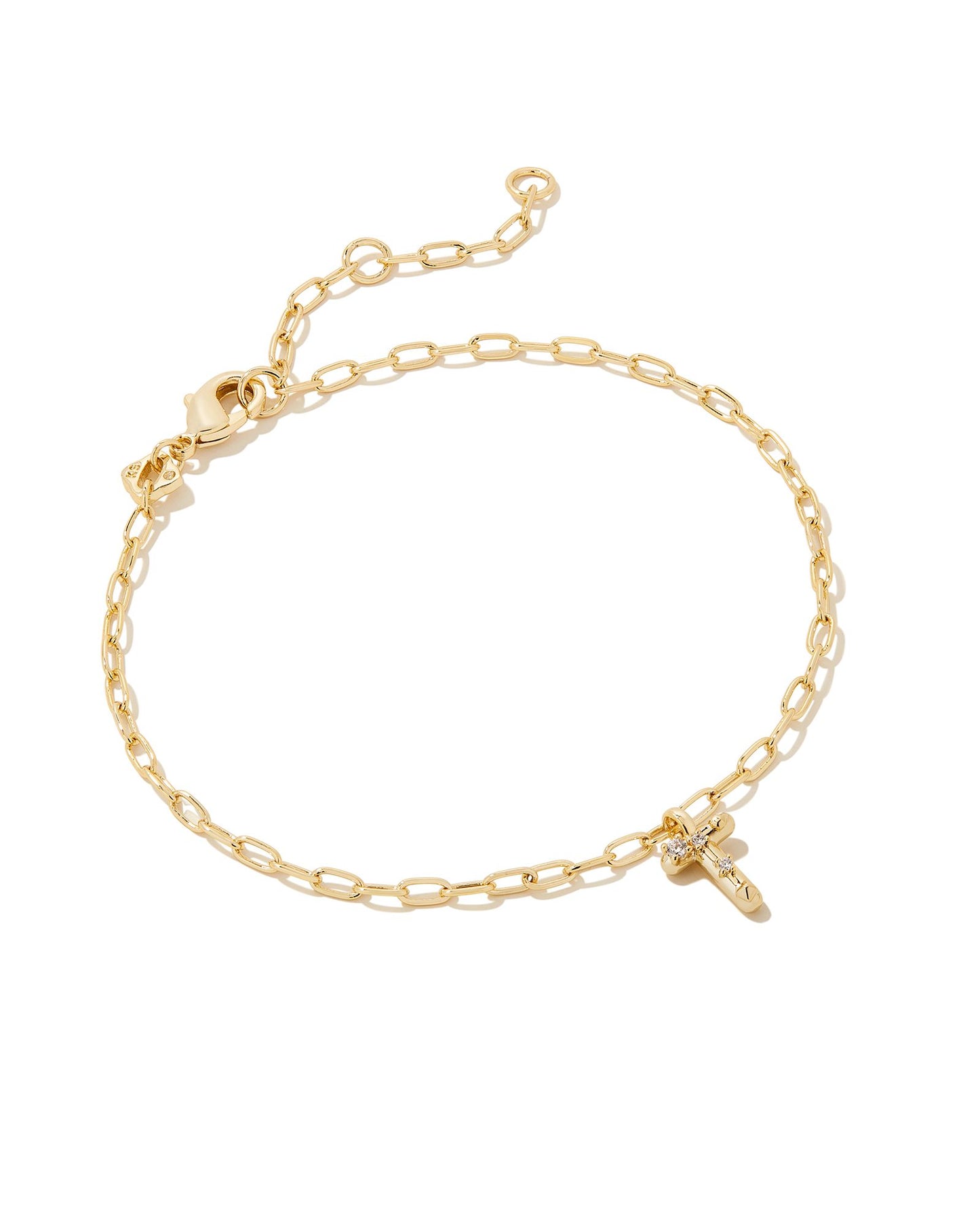 Add a personal touch to your wrist stack with the Crystal Delicate Chain Bracelet in White Crystal, our first Fashion Jewelry initial bracelet. Featuring a dainty chain and letter charm with a hint of sparkle, this bracelet is the perfect way to celebrate the ones you love—including yourself!  Dimensions- 6.5' CHAIN WITH 1.5' EXTENDER, 0.45'L X 0.26"W PENDANT Metal- 14K Gold plated over brass Closure- Lobster Clasp Material-  White CZ Letter T
