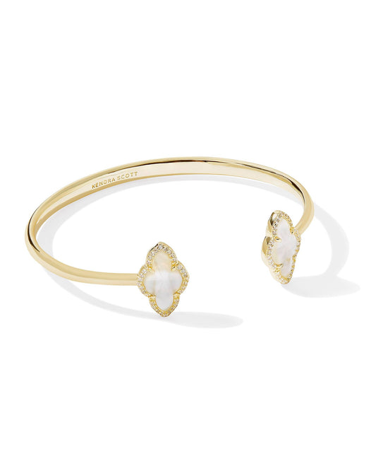 Yellow gold plated cuff bracelet with ivory mother of pearl stone in the Abbie shape. 