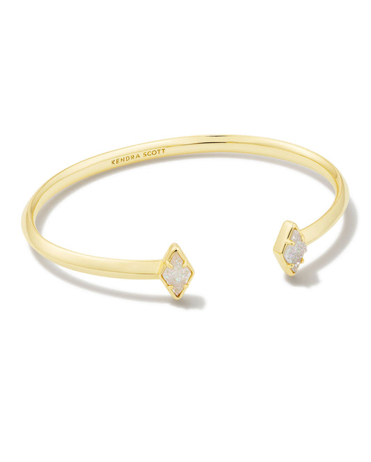 Our beloved cuff style gets a contemporary update in the Kinsley Gold Cuff Bracelet in Iridescent Drusy. Two diamond-shaped stones bookend an adjustable metal cuff for a bracelet that shines all on its own or brings a pop of sparkle to your wrist stack.