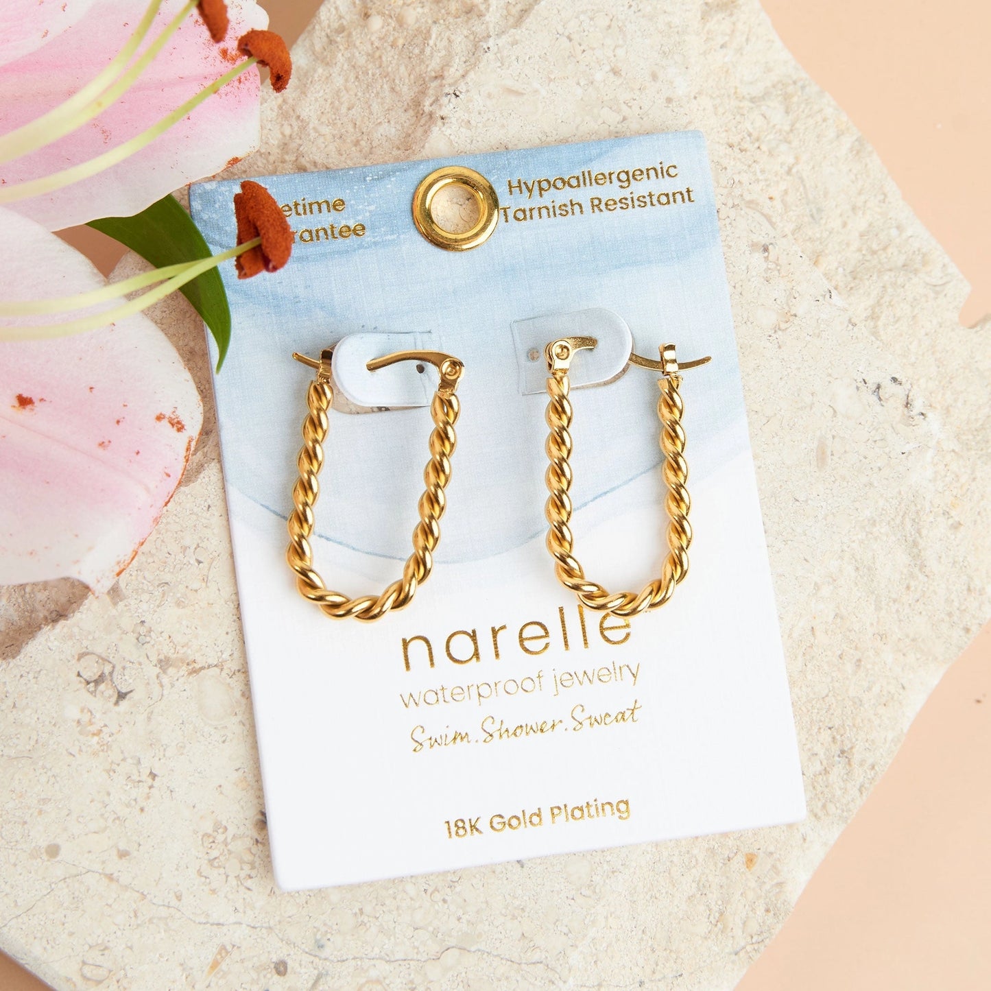 Gold Hoop Earring with a Twisted Chain Design. 