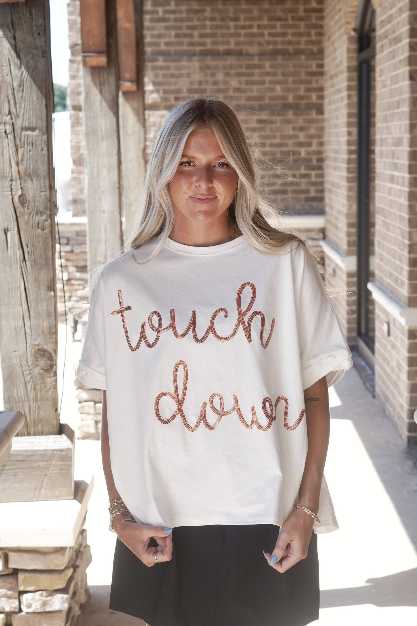 Touch Down Sequin Top Round Neckline Short Sleeves Cropped Oversized Fit Color: White Orange Sequin "Touch Down" Fabric Content: 100% Cotton