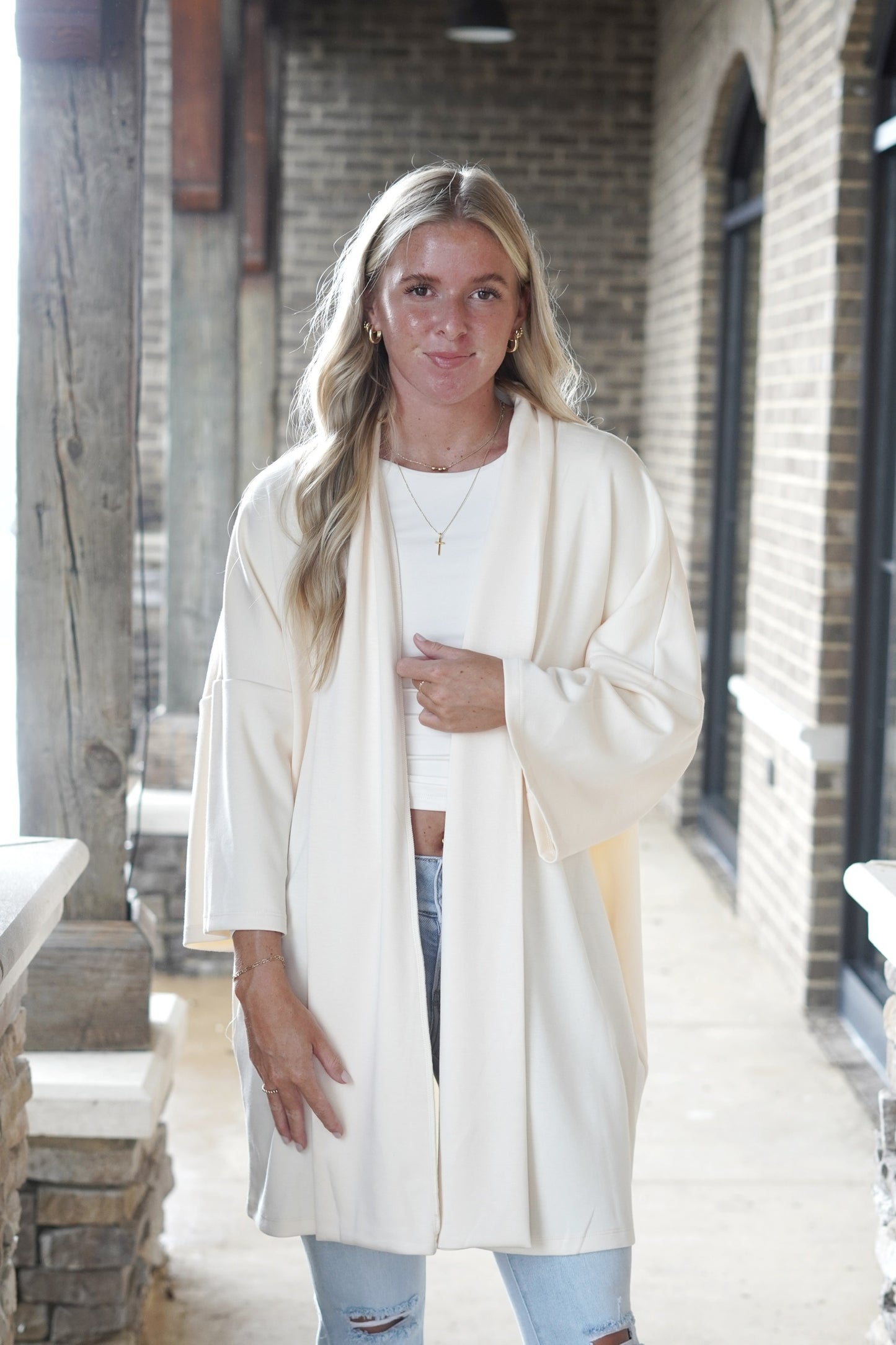 Casual and Cozy Oversized Cardigan&nbsp; 3/4" Sleeves Mid-Thigh Length Oversized Fit Lapel Detail Open Front 50% Rayon, 45% Polyester, 5% Spandex eggshell color