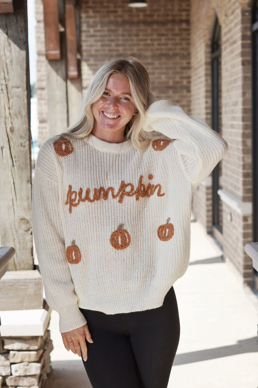 Fall Is Here Pumpkin Stitch Sweater Long Sleeves Crew Neckline Yarn Stitched Sweater Color: Oatmeal Relaxed Fit Yarn Stitched Pumpkins Full Length Lightweight Fabric Content: 100% Polyester