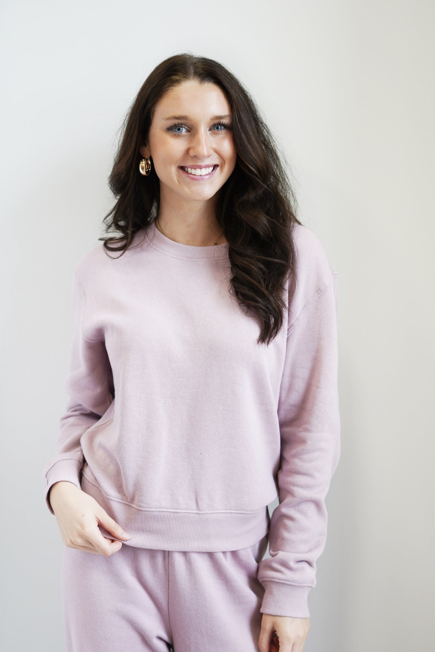 Classic Crew Sweatshirt Crew neckline Dropped shoulder Ribbed cuffs & neckband Length from shoulder 23" Relaxed fit Colors:  Mauve Fleece: 60% Cotton 40% Polyester