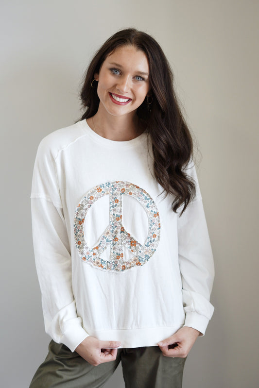 xRemi Raw Hem Peace Sign Graphic Pullover  Crew Neckline  Long Sleeve Peace Sign On Front Of Top Colors:  Off White Relaxed Fit Full Length 100% Cotton, 95% Cotton, 5% Spandex Hand Wash Cold, Water Separately, Do Not Bleach, Hang To Dry.