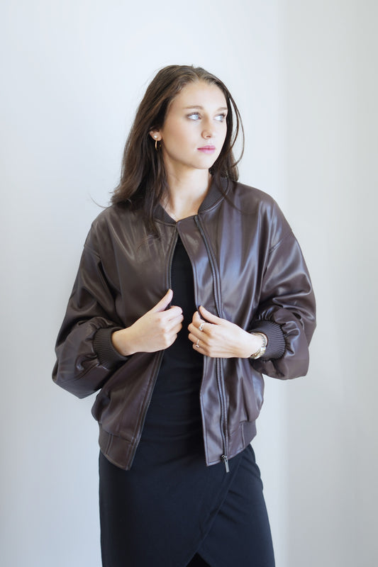 Francy Faux Leather Bomber Jacket Crew Ribbed Neckline Long Cuffed Sleeves Ribbed Cuffed Hem Colors:  Brown Zipper Closure Bomber Jacket Style Front Pockets 97% Polyester, 3% Spandex