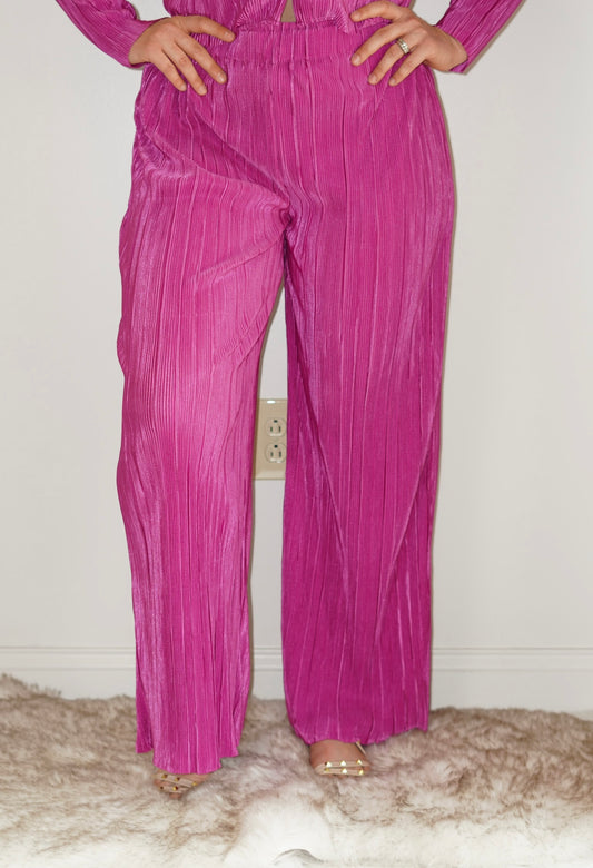 Sadie Satin Elastic Waist Wide-Leg Pants Elastic Waistband Wide Leg Pleated Material Magenta Color Pant length goes below ankles 100% Polyester Hand wash cold, do not bleach. Hang or line dry. Model is wearing size large