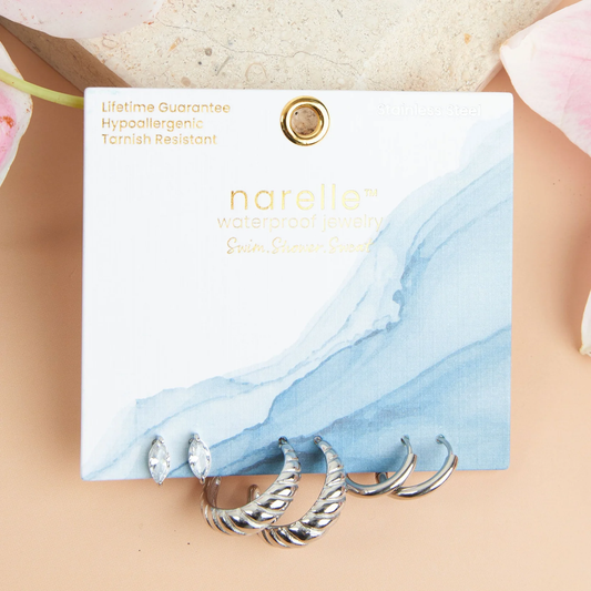  the Narelle Waterproof Half Moon Hoop Earring Trio offers three pairs of earrings in trendy hoop and post designs, all in a classic silver. Go bold with the twisted hoops, or keep it simple with the mini hoops, the options are endless with this versatile set!