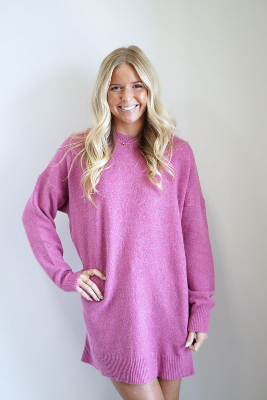 Ollie Oversized Sweater Dress Round Neckline Long Cuffed Sleeves Ribbed Cuffed Hem Pink Color Knee Length Relaxed Fit 37% Polyester, 50% Recycled Polyester, 10% Wool, 3% Spandex Care: Hand wash cold, Do not bleach, Lay flat to dry