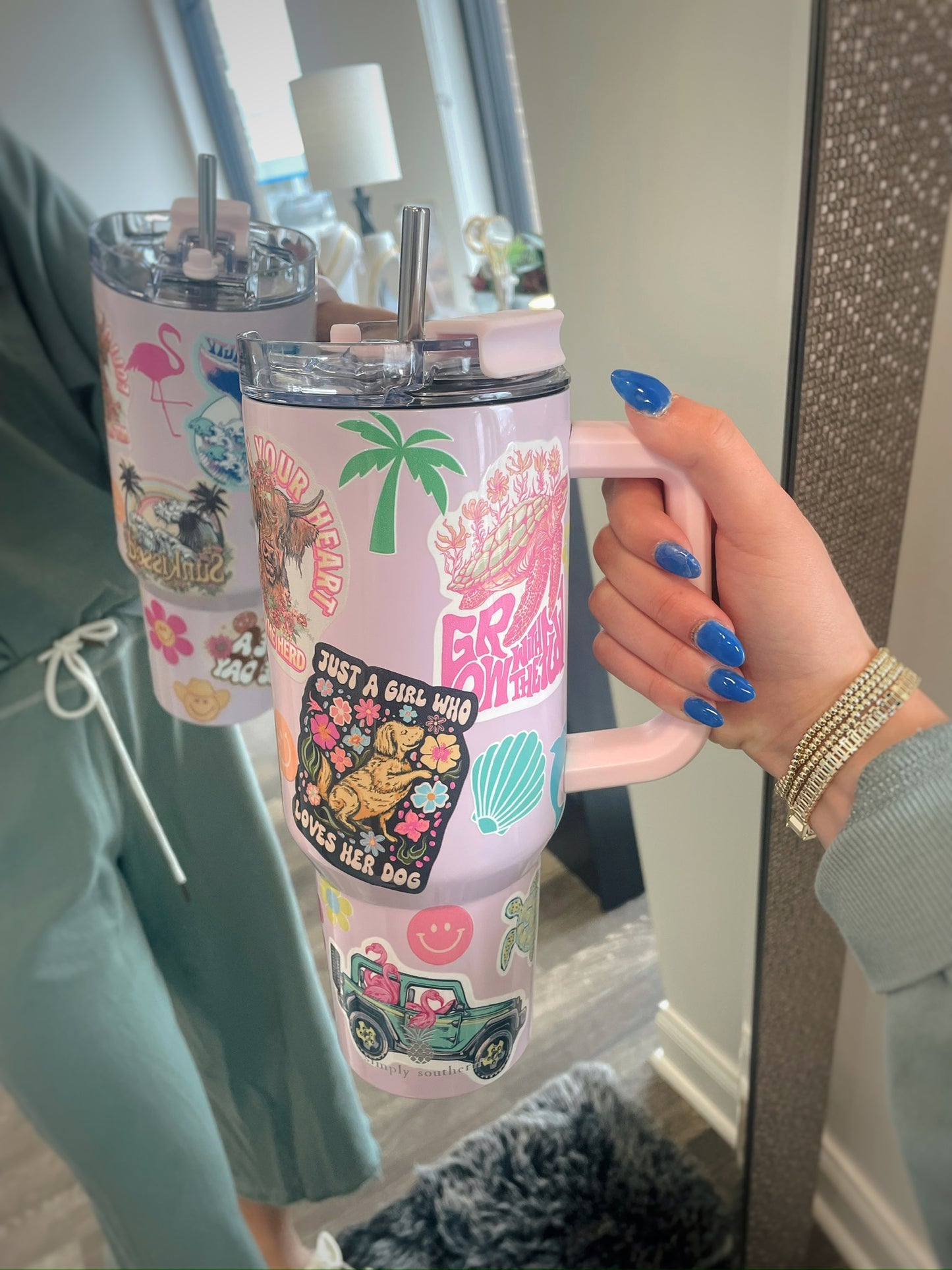 pink tumbler with handle and summer themed graphic stickers 