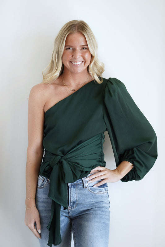 Waverly One Shoulder Satin Tie Top One Shoulder Long Sleeve Satin Material Tie Fabric at the Hem Color: Hunter Green Skimmer Length Side Zipper 100% Polyester Care: Hand wash cold water separately, Color will bleed, Do not bleach, Hang to dry