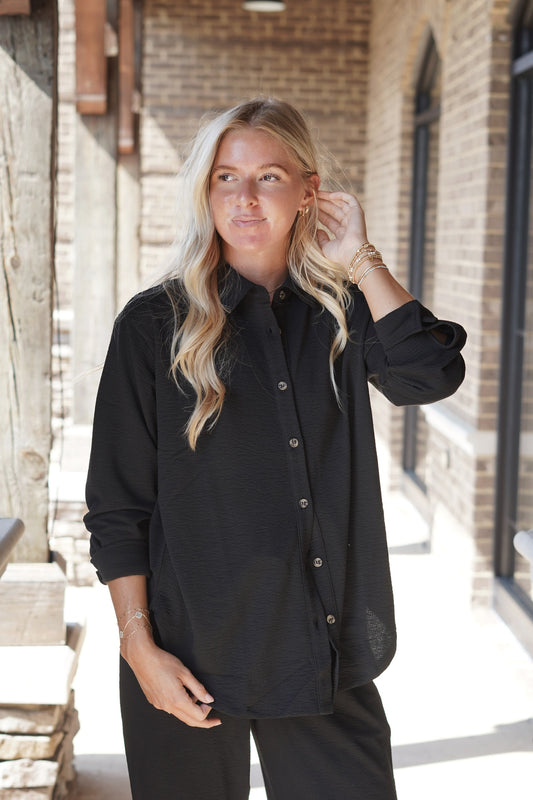 Feel Good Button Up Blouse Collar Neckline Button Up Button Closure Cuffed Sleeve Full Length Relaxed Fit Colors: Black,  Fabric Content: 99% Polyester, 1% Spandex