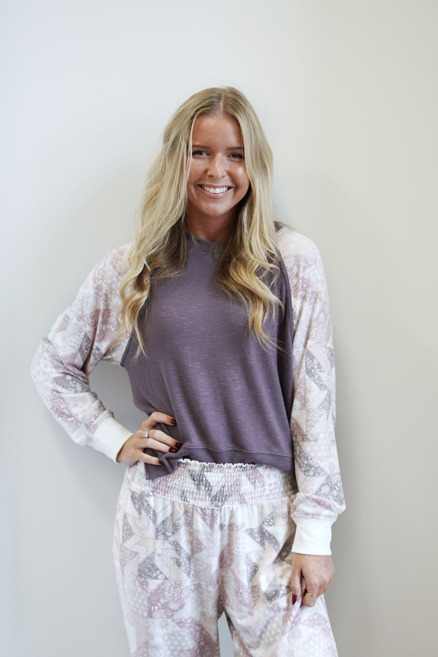 Cammie Quilt Long Sleeve Top Crew Neckline Long Cuffed Sleeves Purple Base w/ Pastel Quilted Pattern on Sleeves Relaxed Fit Full Length Care: Wash Cold