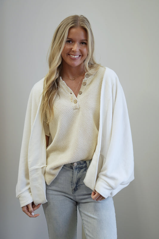 Commuter Fleece Cardigan Oversized fit  60% Cotton, 28% Polyester, 12% Rayon Open front cardigan Curve hem Colors:  Sandstone Front seam detail Mid-weight fleece Care: Wash Cold, Hang Dry