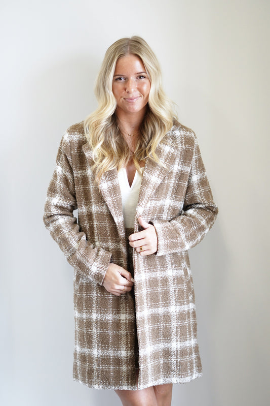 Belle Boucle Plaid Long Coat Collared Neckline Long Sleeves Boucle Material Cream and Brown Plaid Color Oversized Fit Mid-Thigh Length 100% Polyester Care: Dry Clean Only