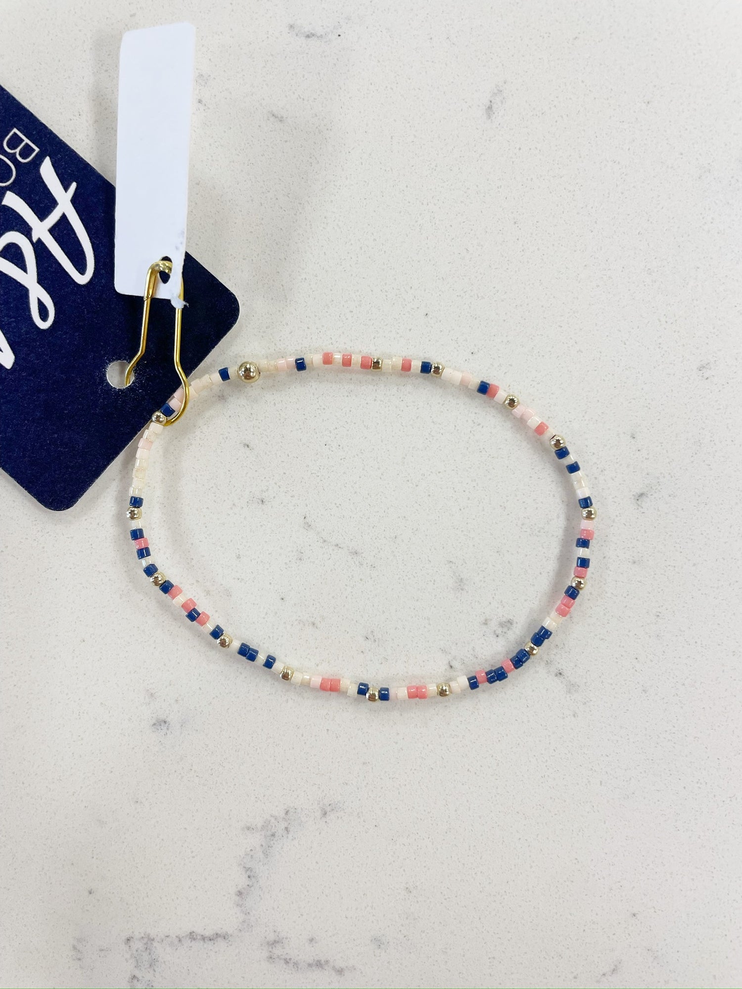 navy, pink mix, white, and gold beaded bracelet