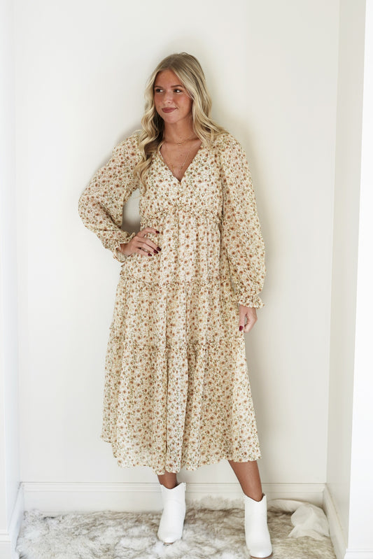 Francy Floral Chiffon Midi Dress V-Neckline Long Peasant Sleeves Ruffle Hem Detailing Tiered Detail Color: Cream Green, Orange, and Yellow Pastel Floral Print Midi Length 100% Polyester