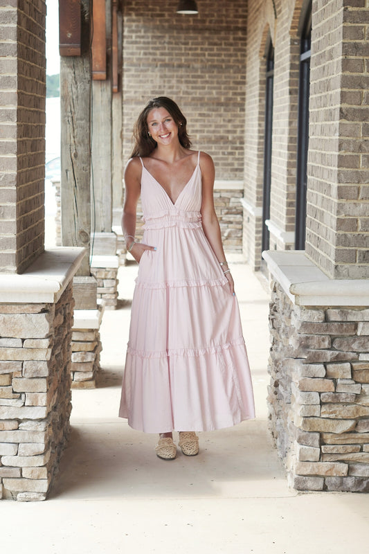 Bella Boho Ruffled V-Neck Maxi Dress V-Neckline Sleeveless Adjustable Spaghetti Straps Ruffle Lined Bodice Tiered Ruffle Design Color: Pink Maxi Length Relaxed Fit Pockets 62% Rayon, 30% Polyester, 8% Nylon