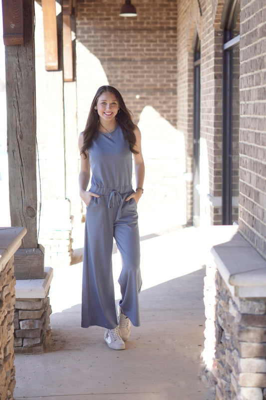Blue Skies Everyday Jumpsuit Round Neckline Sleeveless Color: Slate Blue Waist Tie  Full Length Wide Leg Fit 49% Polyester, 45% Cotton, 6% Rayon