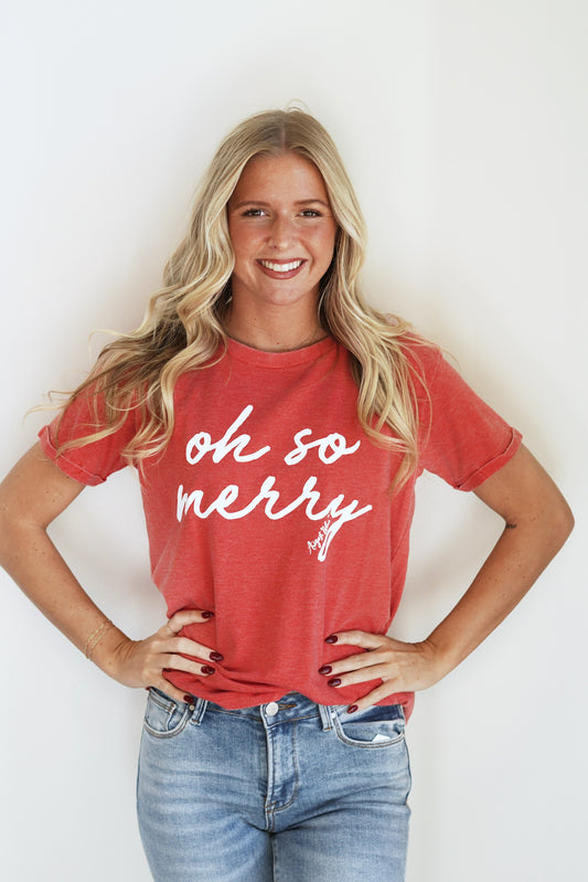 "Oh So Merry" Red Tee Crew Neckline Short Sleeves "Oh So Merry" in White Lettering Color: Red Full Length Relaxed Fit 55% Cotton, 45% Polyester