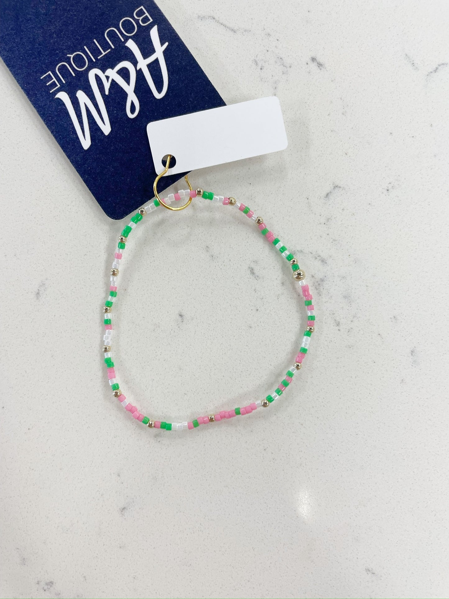 bright green, pink, white, and gold beaded bracelet