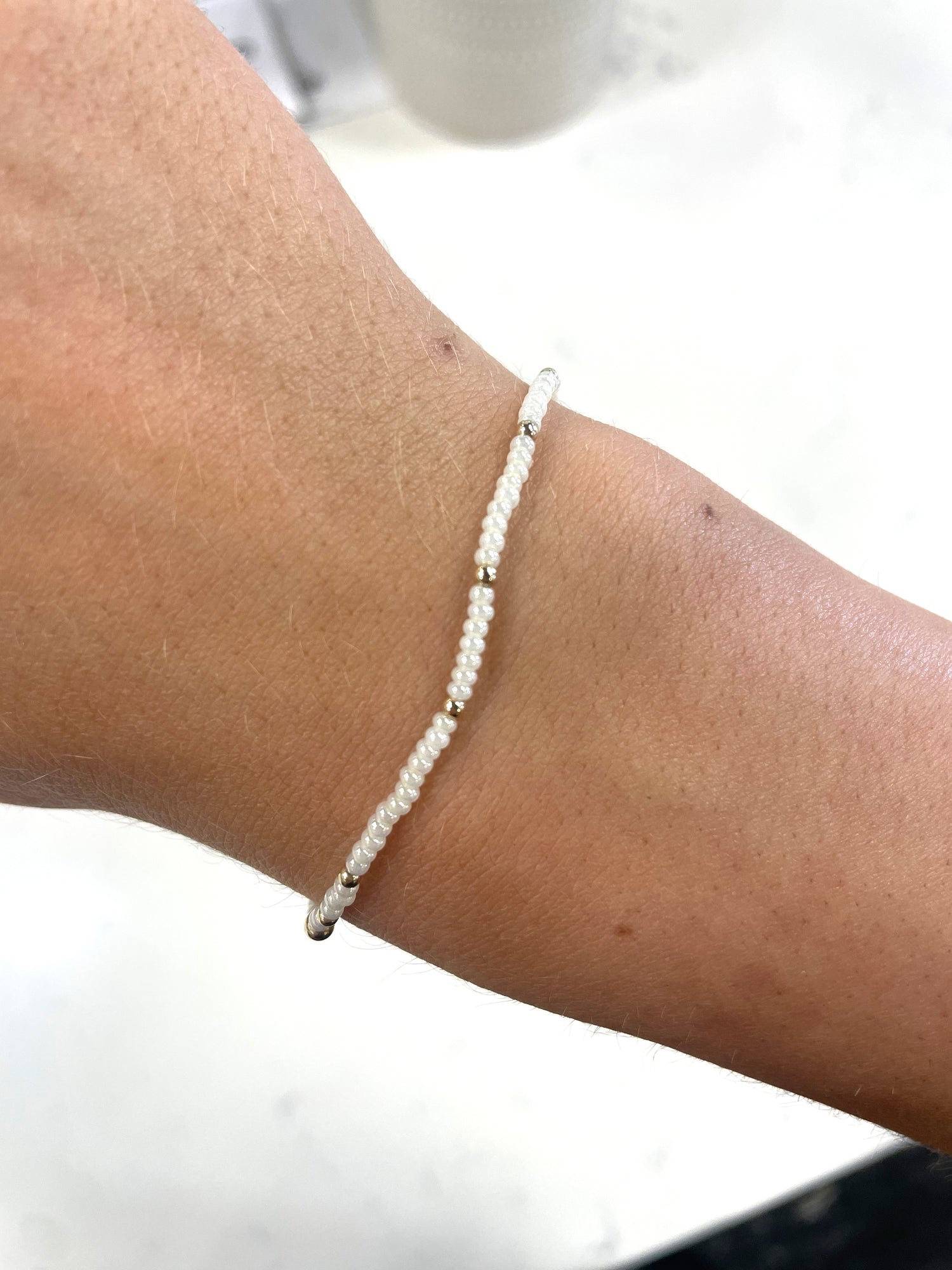 white pearl and gold small beaded bracelet