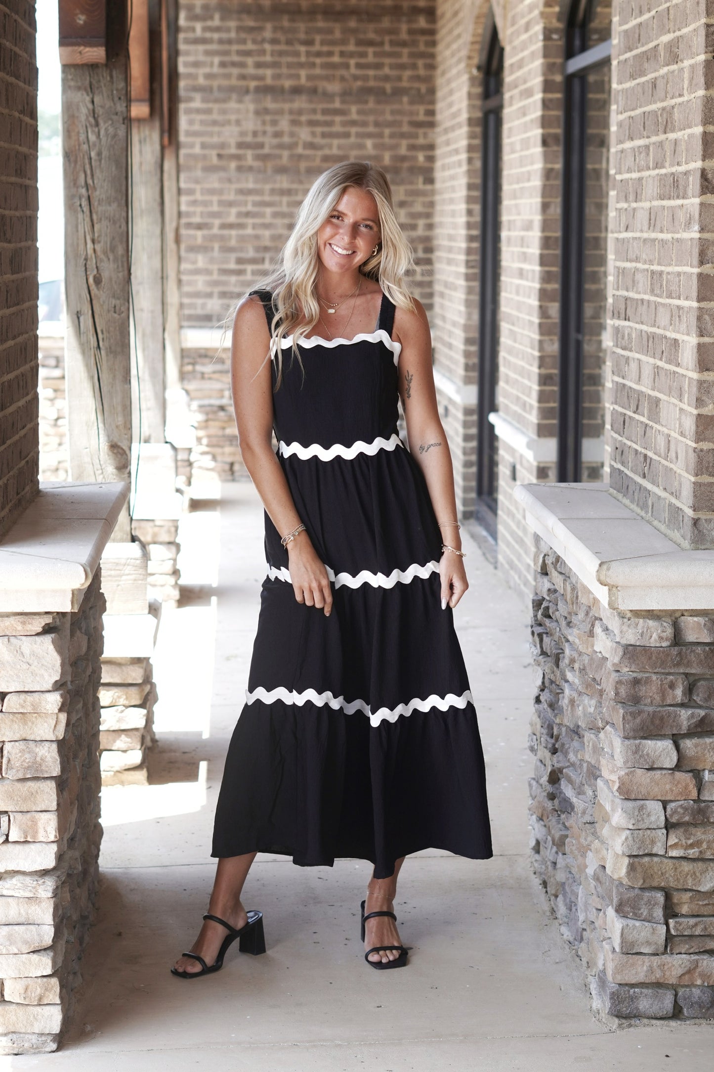 Bliss Scalloped Midi Dress Elastic Straps Sleeveless White Scallop Trim Color: Black&nbsp; Midi Dress Pockets Fabric Content: 100% Polyester