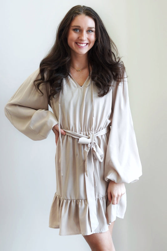Willow Waist Tie Ruffled Hem Dress V-Slit Round Neckline w/ Ties Long Sleeves Ruffled Hem Colors:  Taupe Waist Tie 100% Polyester