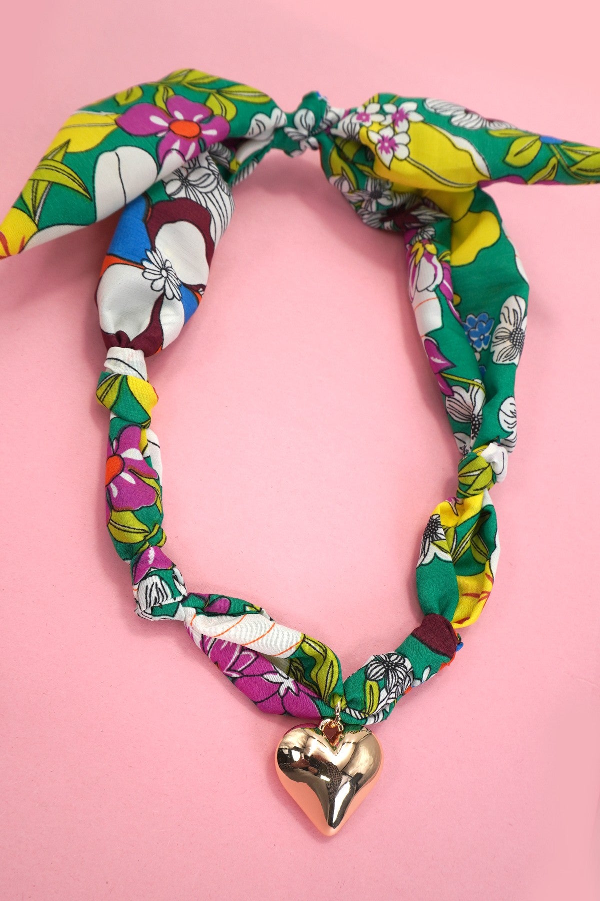 Handmade Scarf Necklace - Heart is a crafted with care, this soft fabric scarf doubles as a stylish necklace, featuring a delicate heart charm that adds a sweet, personal touch. Lightweight and versatile, it is perfect for layering.
