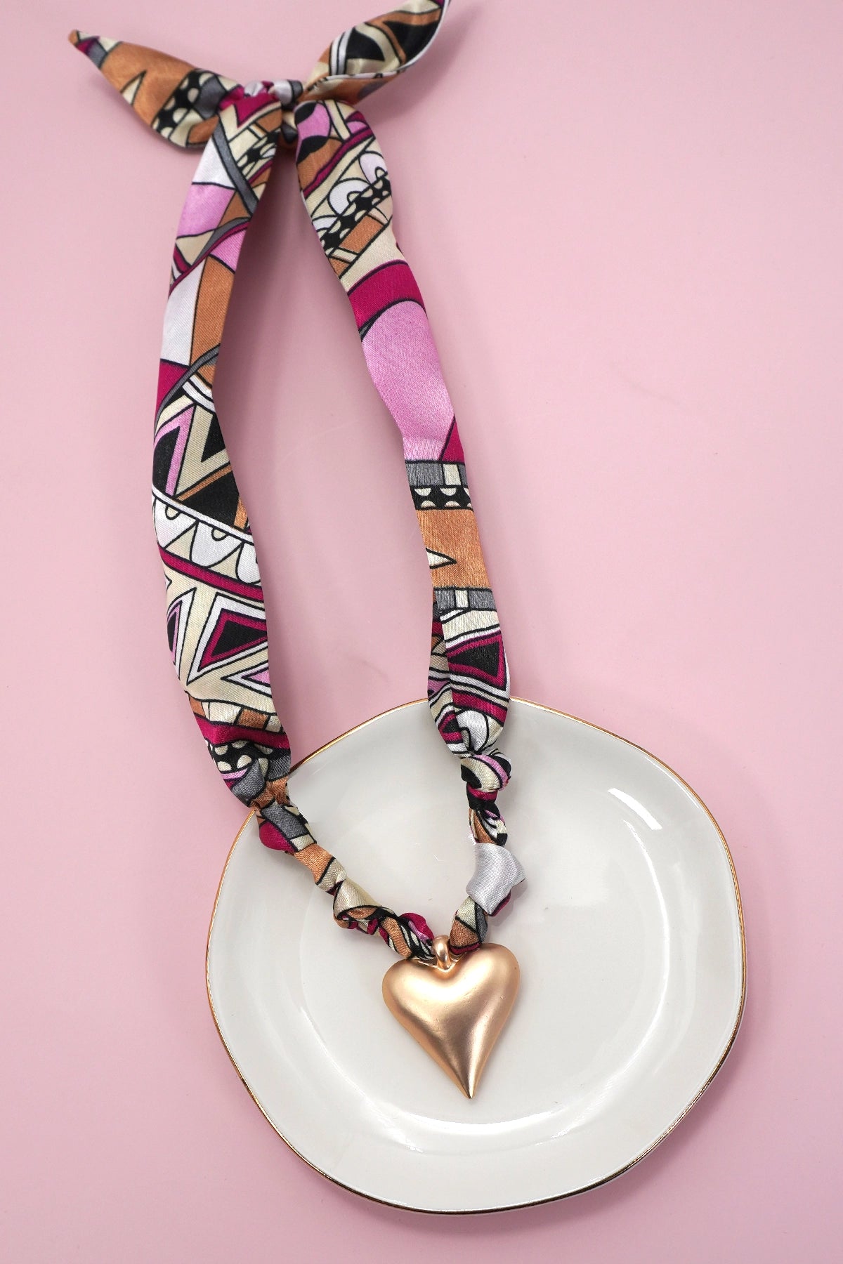 Handmade Scarf Necklace - Heart is a crafted with care, this soft fabric scarf doubles as a stylish necklace, featuring a delicate heart charm that adds a sweet, personal touch. Lightweight and versatile, it is perfect for layering.
