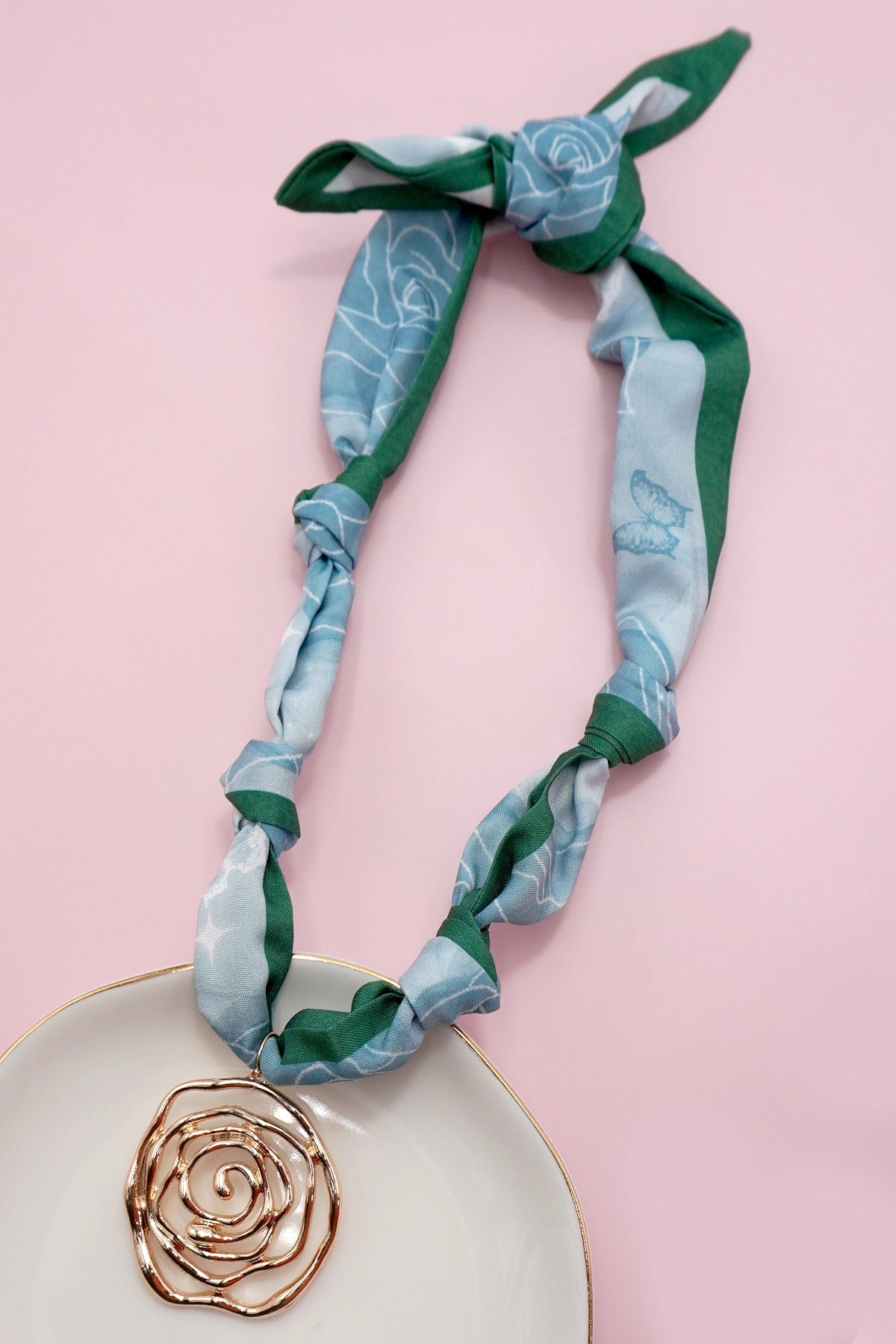 Handmade Scarf Necklace - Heart is a crafted with care, this soft fabric scarf doubles as a stylish necklace, featuring a delicate heart charm that adds a sweet, personal touch. Lightweight and versatile, it is perfect for layering.
