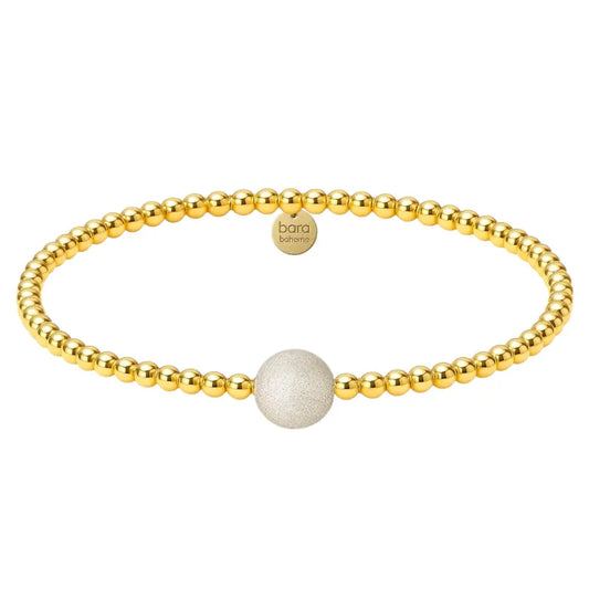 Gold beaded bracelet with one large sparkly bead