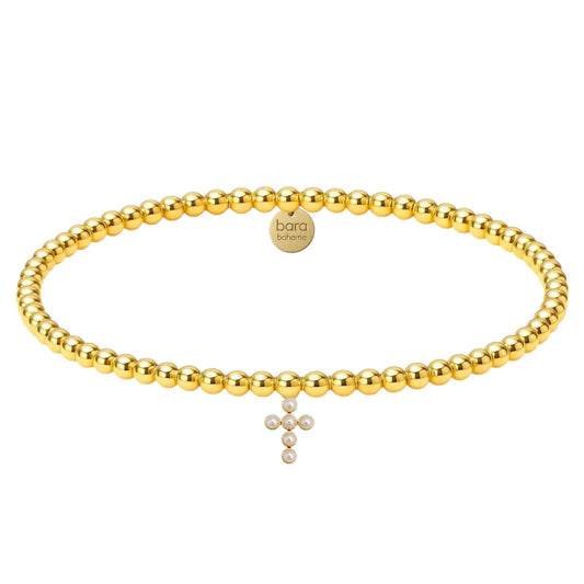 gold beaded bracelet with pearl cross charm