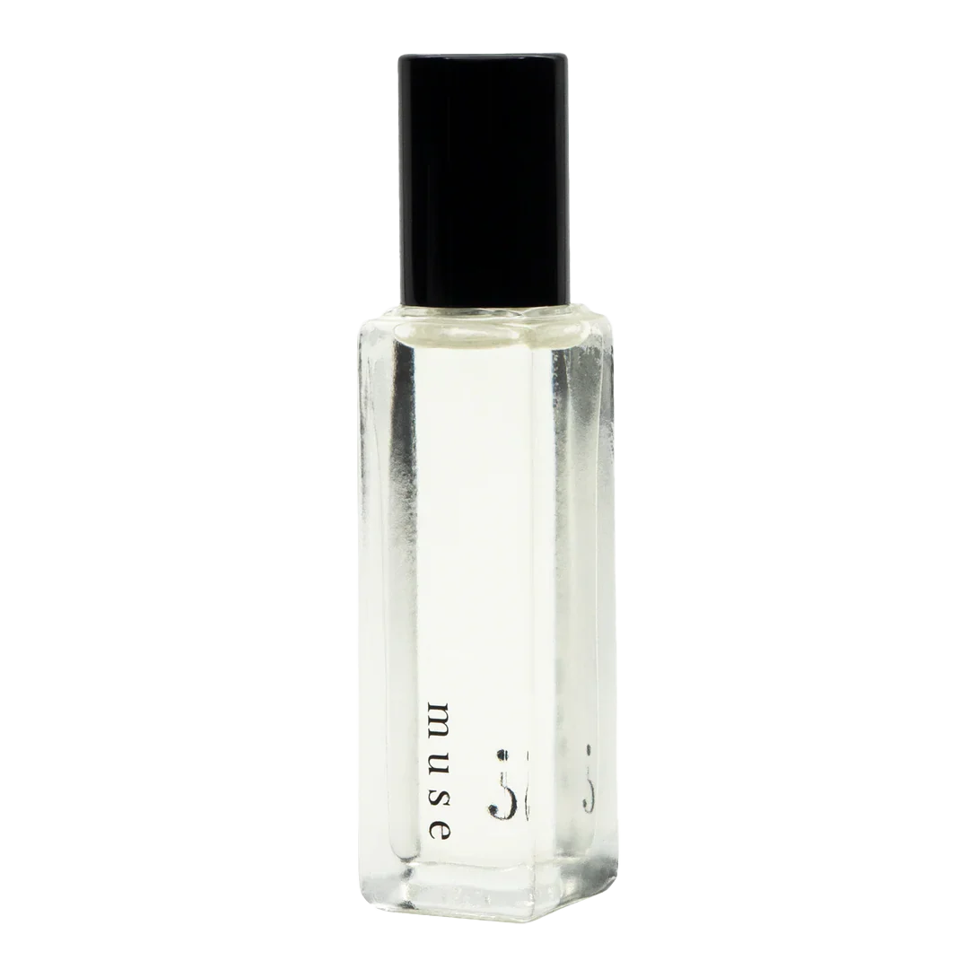 A clear small bottle with a black lid and "Muse " written in black. 