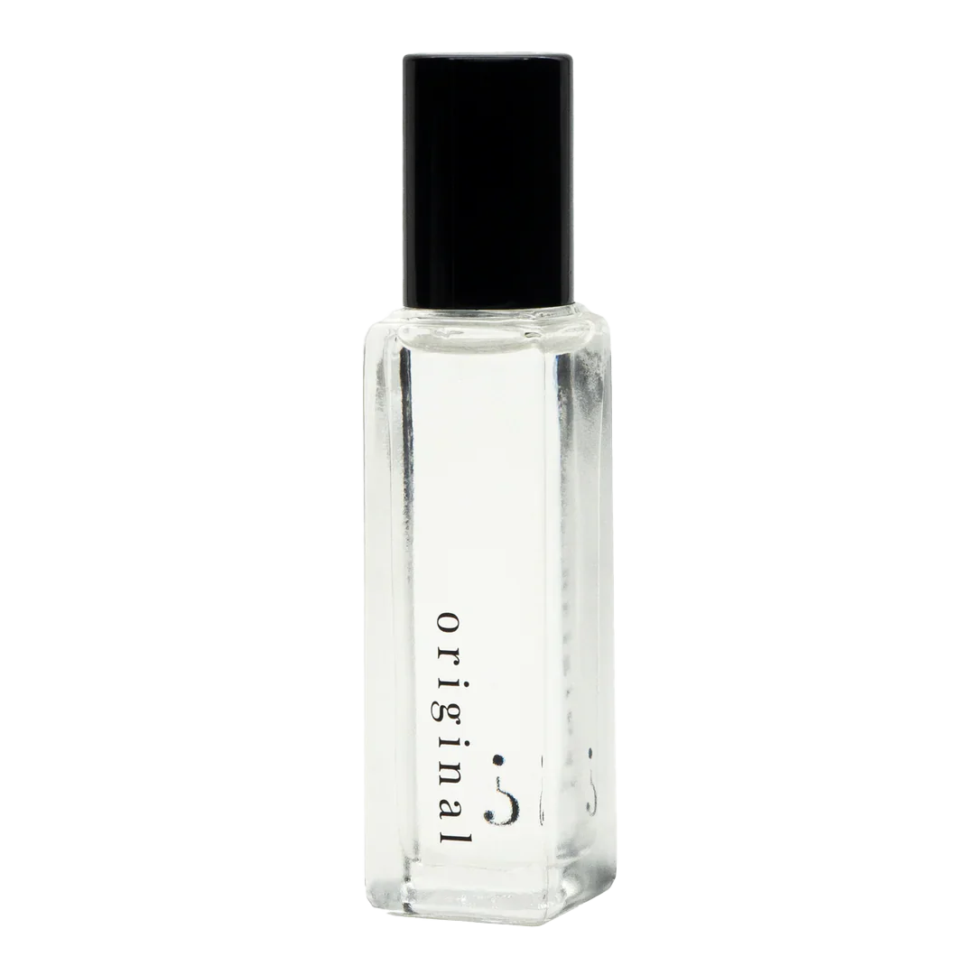 A clear small bottle with a black lid and "original " written in black. 