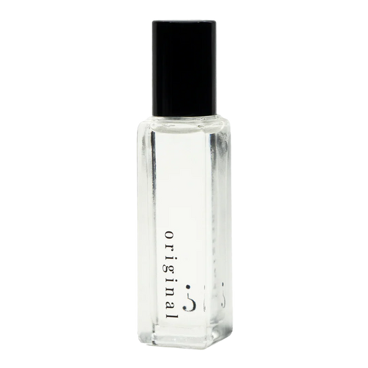 A clear small bottle with a black lid and "original " written in black.