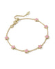 Gold chain bracelet with pink flower evenly space out. 