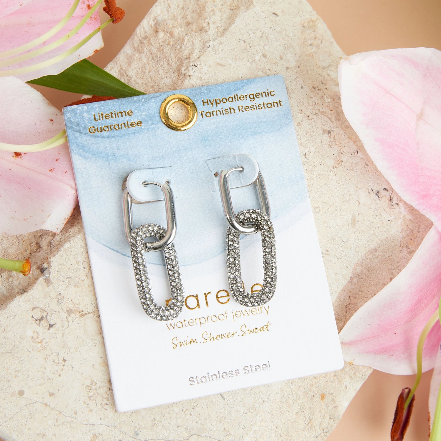 Sliver Pave Linked Hoop Earrings with embedded gemstones. 