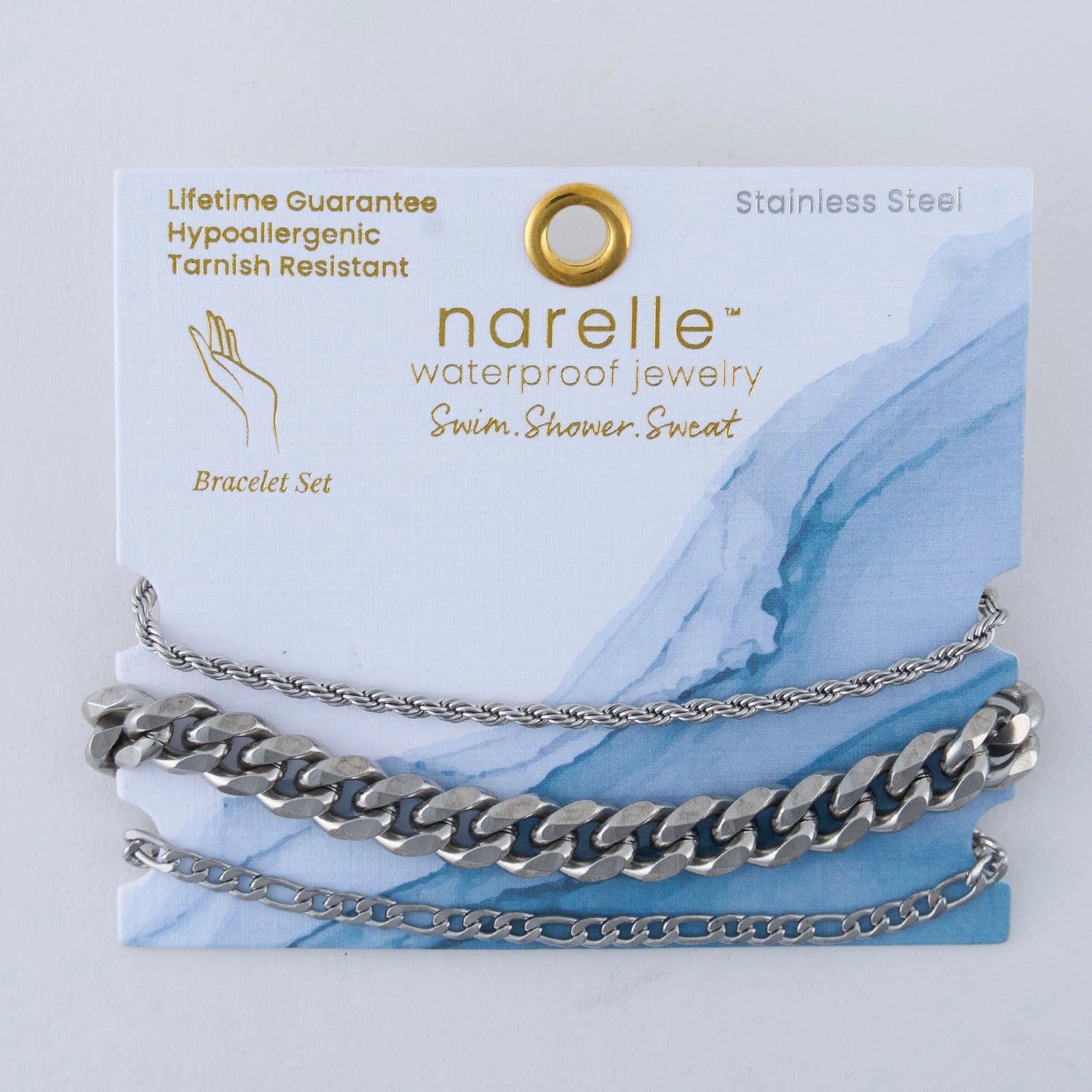 three pairs of silver bracelets in Chunky, Figaro, and Dainty Chain designs