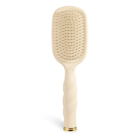 Oval hair brush, beige handle, gentle glide bristle, textured handle with gold trim.