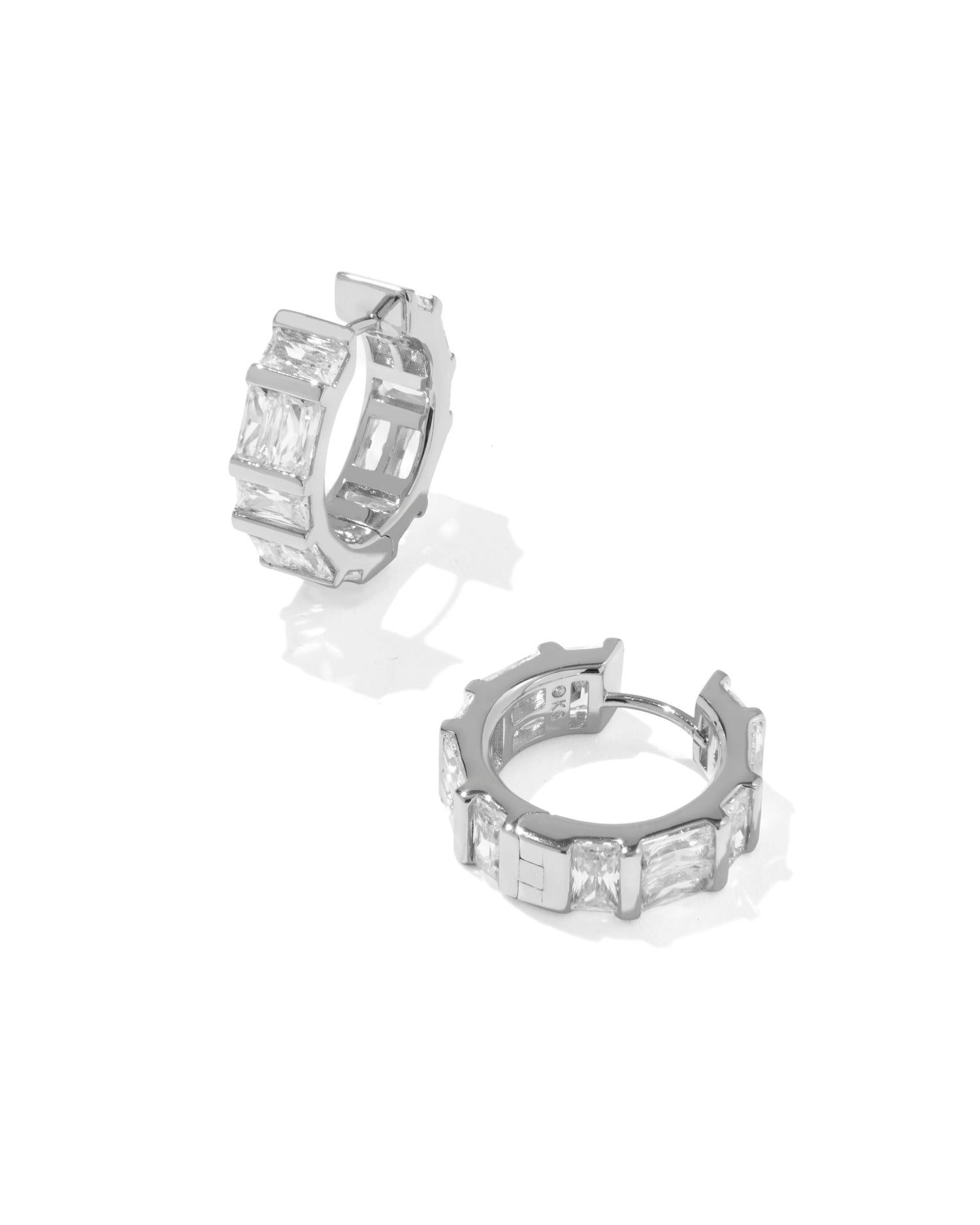 Rhodium Huggie Earrings with bezel-set baguette crystal detailing and high-shine metal